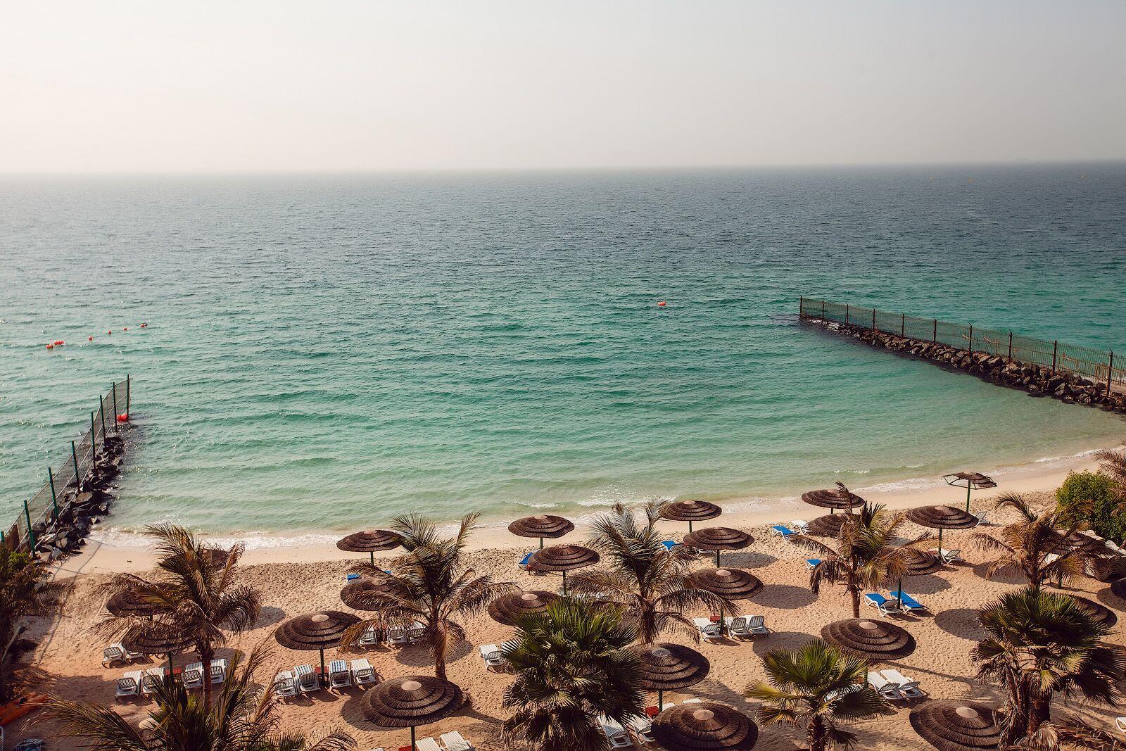 Sahara Beach Resort & Spa Sharjah Exterior photo The beach at the Kempinski Hotel, Muscat
